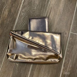 Sleek rose gold clutch and wallet.